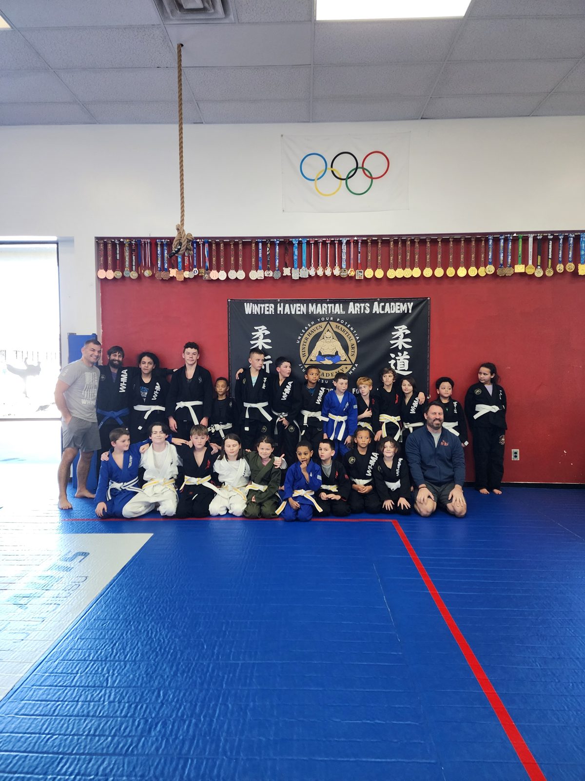 Kids and adults group photo after a martial arts class at Winter Haven Martial Arts Academy